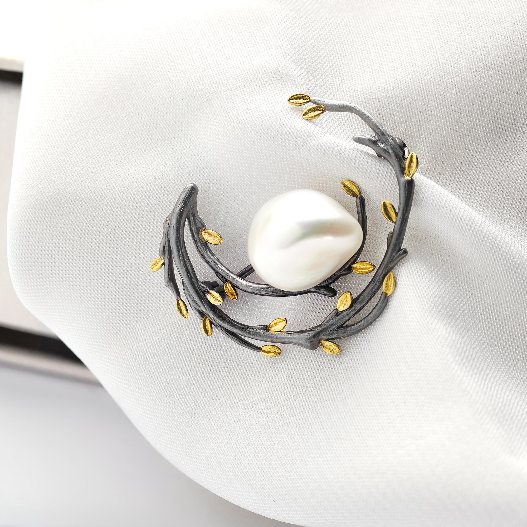 close-up gold thread monogram on silk
