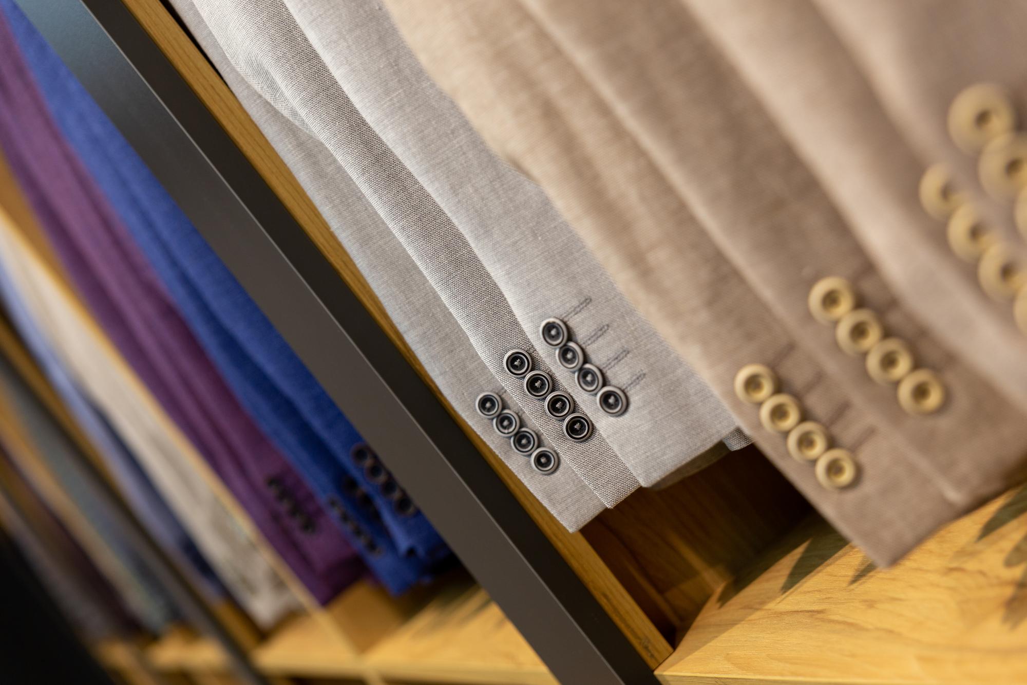 stack of embroidered fabric samples
